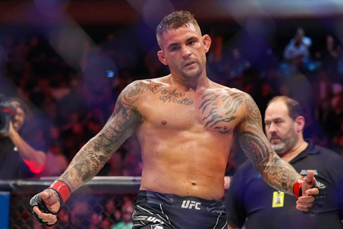 Dustin Poirier celebrates inside the UFC Octagon following a win over Michael Chandler inside Madison Square Garden in New York City.